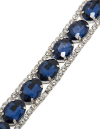 Crafted from silver with blue diamantes, this statement bracelet is shown in close up view - link has visual effect only