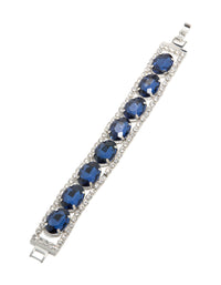 Designed with blue diamantes, this statement bracelet in silver is displayed in front view - link has visual effect only