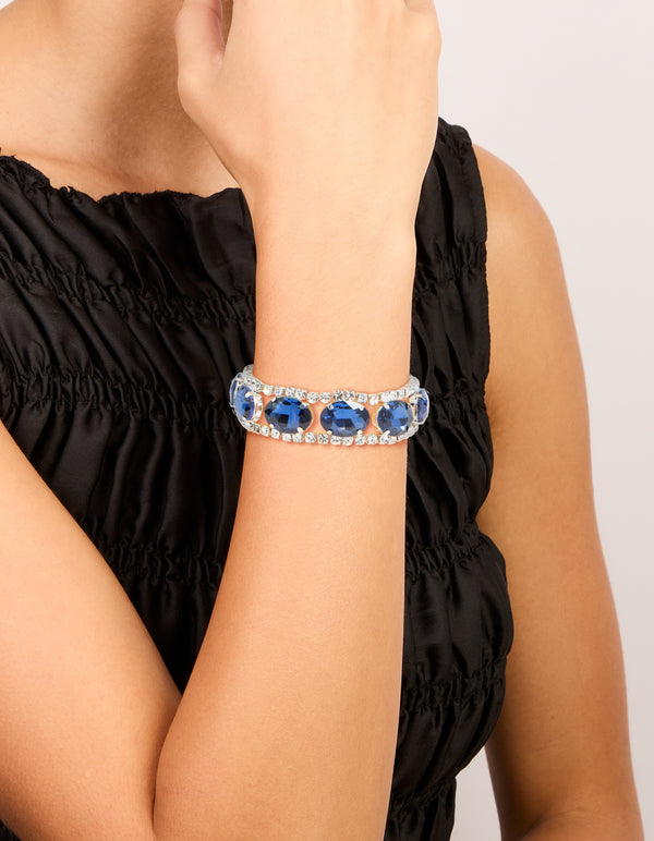 Showcasing a statement bracelet with blue diamantes on wrist view