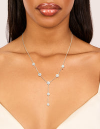 Showcasing a cubic zirconia mini floral y necklace in dainty silver on neck view - link has visual effect only