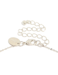 Highlighting the lobster claw clasp and extender chain of cubic zirconia mini floral y necklace in dainty silver clasp detail view - link has visual effect only