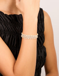 Featuring a gold mini bezel set wrist cuff crafted from cubic zirconia on wrist view - link has visual effect only