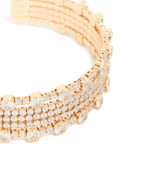 Highlighting a gold mini bezel set cubic zirconia wrist cuff close up view - link has visual effect only