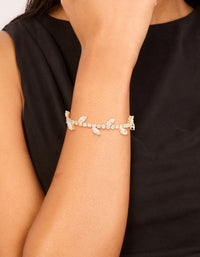 Beautifully designed cubic zirconia marquise vine toggle bracelet featuring with leaf in gold on wrist view - link has visual effect only