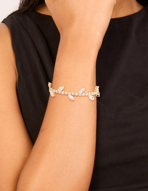 Beautifully designed cubic zirconia marquise vine toggle bracelet featuring with leaf in gold on wrist view