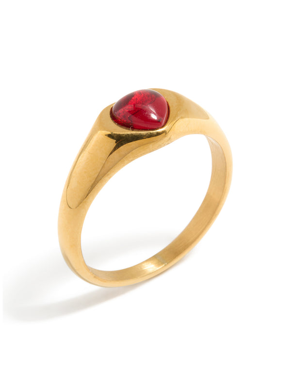 Stunning waterproof gold plated stainless steel petite heart ring featuring crimson gemstone close up view
