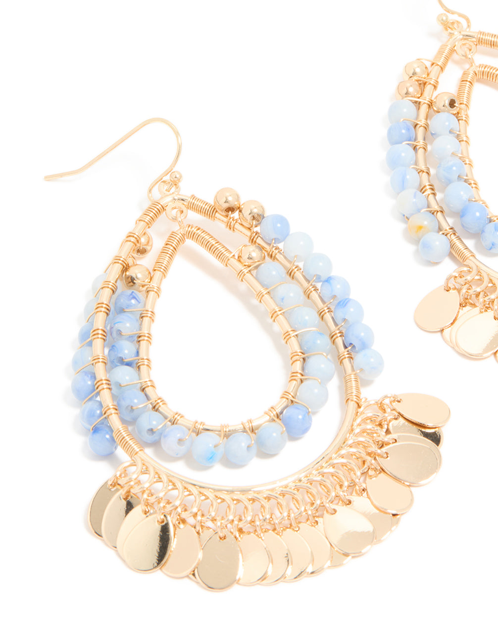 Detailed view of statement teardrop earrings with blue beads and gold disc layered design close up view
