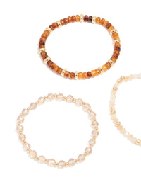 Featuring clear and brown beaded stretch bracelets in a 3-pack with gold accents close up view - link has visual effect only