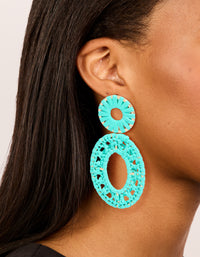 Showcasing aqua blue paper patterned oval drop earrings with statement style and gold accents on ear view - link has visual effect only