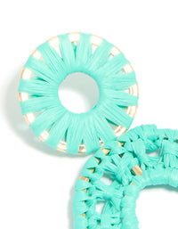 Displaying aqua blue paper patterned oval drop earrings in medium turquoise and gold close up view - link has visual effect only