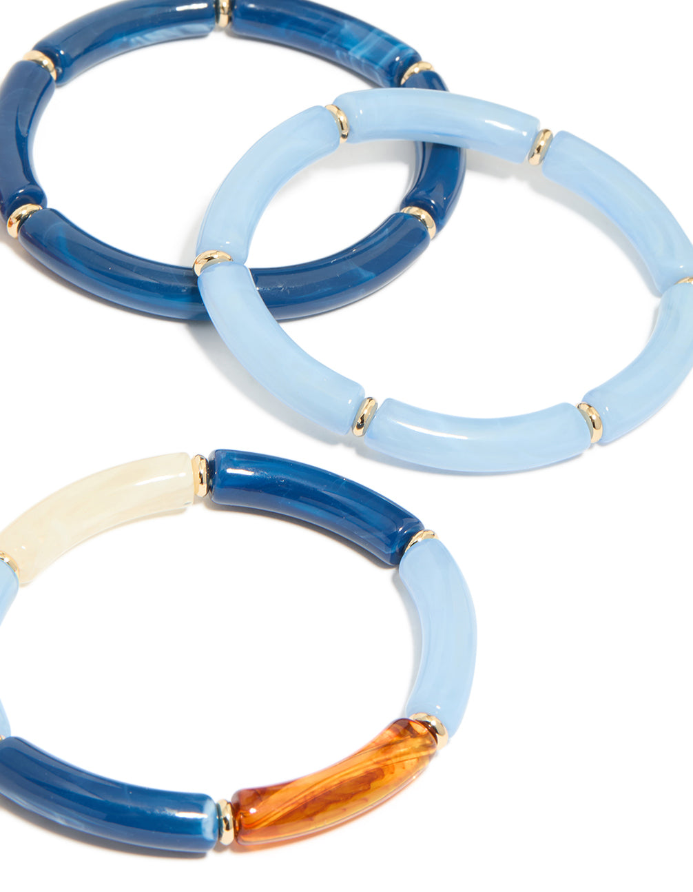 Crafted from beaded acrylic with gold spacers in light blue, dodger blue, and orange close up view