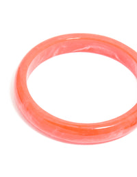 Showcasing acrylic coral thin bangles with marble pattern and gold accents in a 4-pack set close up view - link has visual effect only