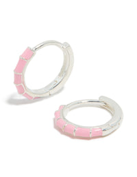 Beautifully crafted sterling silver pink enamel bamboo huggie earrings featuring hoop closure front view - link has visual effect only