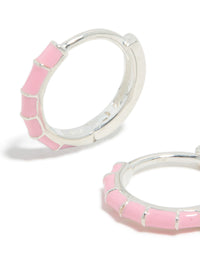 Detailed view of sterling silver pink enamel bamboo huggie earrings with hoop closure close up view - link has visual effect only