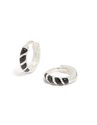 Showcasing sterling silver black striped enamel huggie earrings with hoop closure front view - link has visual effect only