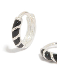 Crafted from sterling silver, these black striped enamel huggie earrings feature hoop closure close up view - link has visual effect only