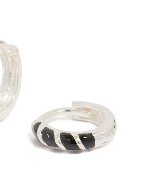 Designed with sterling silver and black striped enamel, these huggie earrings include hoop closure post detail view