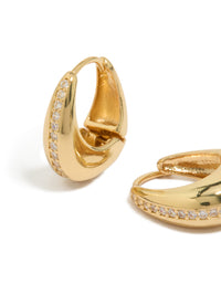 Explore teardrop huggie earrings in gold plated brass featuring cubic zirconia stones close up view - link has visual effect only