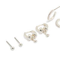 Showcasing dainty silver plated brass double rondell huggies and stud earrings in a 4-pack with crystal accents close up view - link has visual effect only
