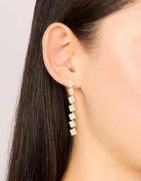 Showcasing gold plated cubic zirconia drop earrings on ear view - link has visual effect only