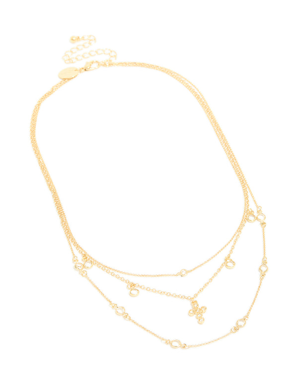 Finely crafted gold plated layered necklace featuring cubic zirconia bezel settings and cross pendant in statement design front view