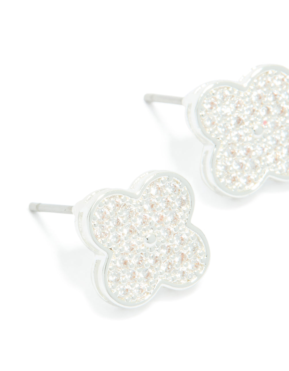 Highlighting dainty small floral stud earrings featuring silver plated metal and cubic zirconia in white close up view