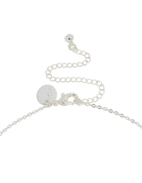 Displaying a silver plated cubic zirconia dainty vine spaced necklace with leaf design clasp detail view - link has visual effect only