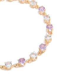 Detailed view of gold purple and grey cubic zirconia bracelet highlighting lavender and light cyan stone settings close up view - link has visual effect only