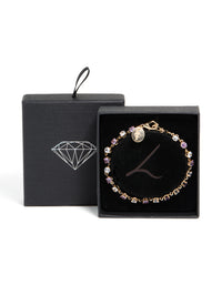 Elegant gold purple and grey cubic zirconia bracelet featuring lavender and light cyan stones front view - link has visual effect only