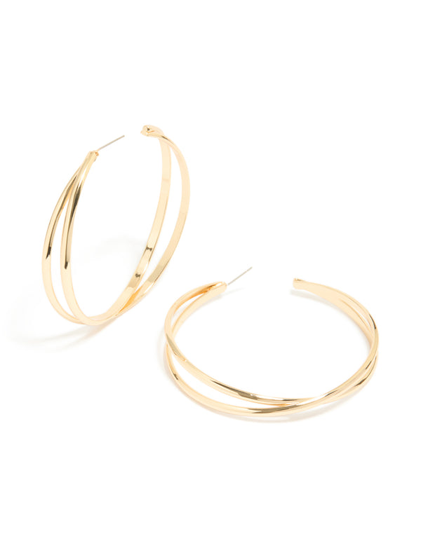Showcasing large crossover hoop earrings in gold with a polished finish front view