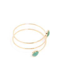 Showcasing a gold statement arm cuff with teal stones front view - link has visual effect only