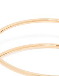 Featuring a gold statement arm cuff with teal stones close up view - link has visual effect only