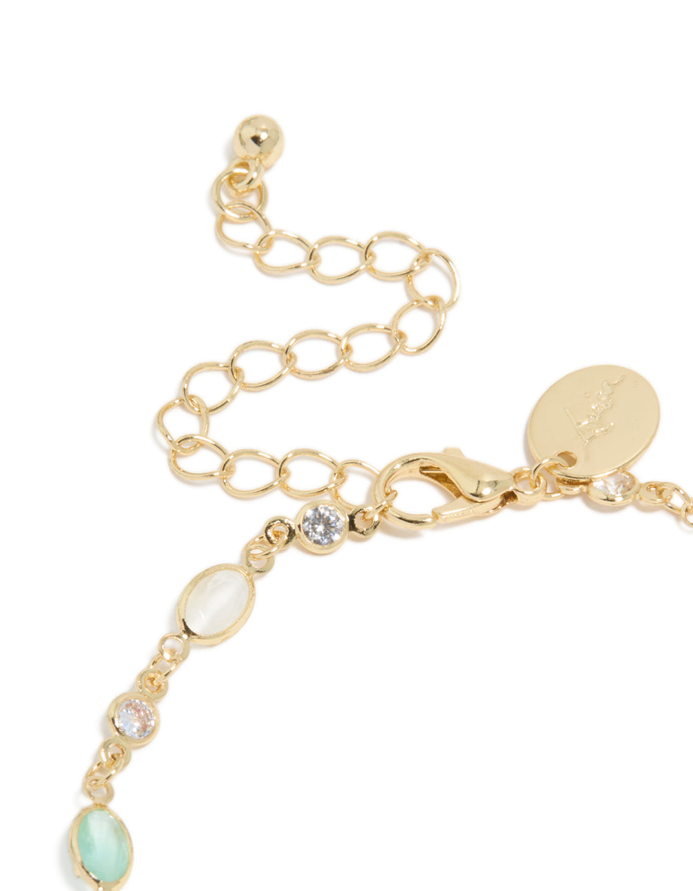 Beautiful gold plated bracelet with clear and blue cubic zirconia in oval stone closure detail view