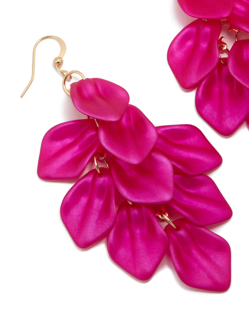 Crafted from fuchsia pink coated metal featuring statement petal drop earrings with floral design and gold hardware close up view