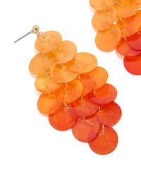 Showcasing orange genuine shell layered discs waterfall drop earrings with statement style close up view - link has visual effect only