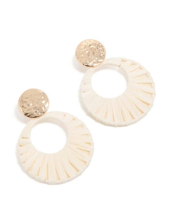 Showcasing statement drop earrings featuring gold hammered studs with white raffia paper circle drops in ivory and wheat tones front view