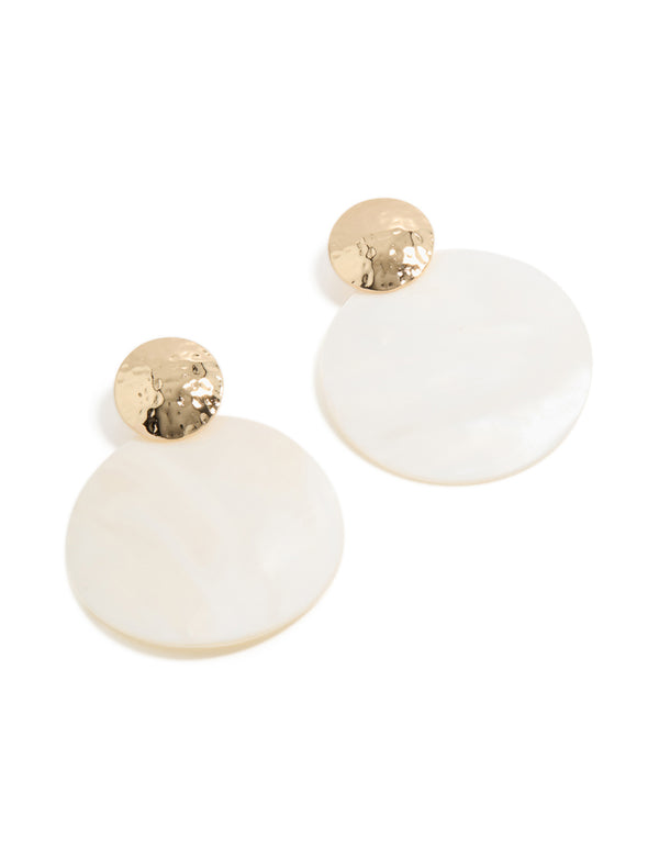 Showcasing statement drop earrings crafted from hammered gold and white genuine shell front view