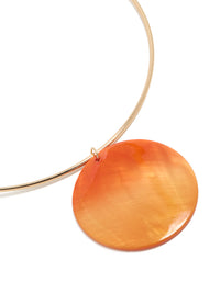 Featuring a gold orange genuine shell disc torque necklace statement style close up view - link has visual effect only