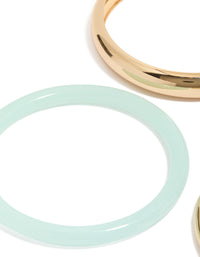 Showcasing gold and blue acrylic stackable bangle bracelets in a 4-pack close up view - link has visual effect only