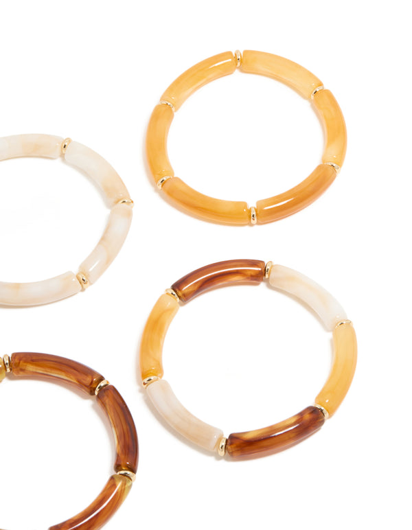 Crafted with bead detailing, these gold brown and orange acrylic stretch bracelets offer a close up view