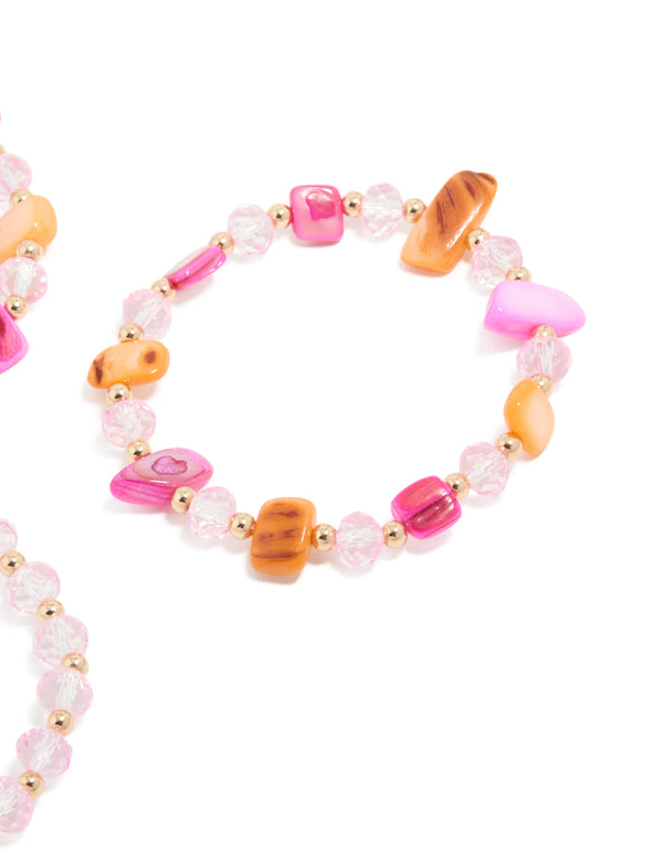 Featuring beaded stretch bracelets in a 3-pack with hot pink peachpuff lightpink and gold tones close up view