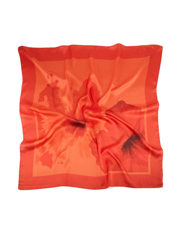 Featuring an orange fabric scarf with double hibiscus floral print in coral, tomato, dark orange, and maroon hues, front view