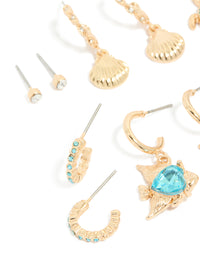 Presenting a gold aqua diamante stingray and sea life earrings 6-pack with heart and ocean shell turquoise details close up view - link has visual effect only