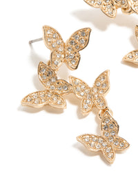 Crafted with gold diamante butterfly feature drop earrings in statement close up view - link has visual effect only