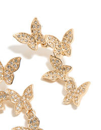 Crafted with gold diamante butterfly feature drop earrings in statement close up view - link has visual effect only