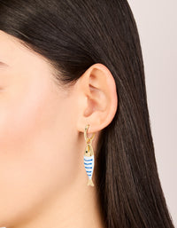 Showcasing statement huggie earrings with animal fish charm in striped pattern and ocean theme on ear view - link has visual effect only