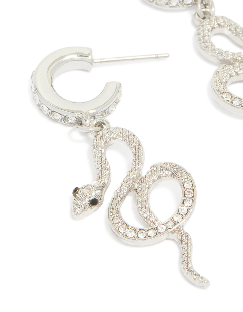 Featuring silver diamante snake huggie earrings in statement style close up view