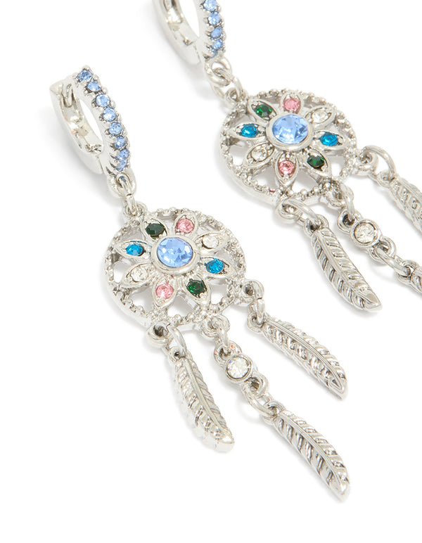 Stunning silver diamante dreamcatcher huggie earrings with charm and feather detail accents in light blue, pink, and teal, close up view