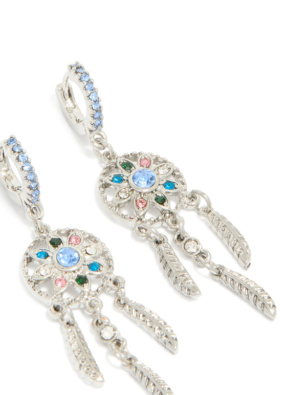 Elegant silver diamante dreamcatcher huggie earrings with charm and feather detail accents in light blue, pink, and teal, front view