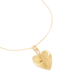 Showcasing a gold plated cubic zirconia heart, cross necklace with pendant close up view - link has visual effect only